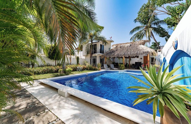 Serene Escape with Pool Surrounded by Lush Gardens