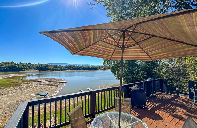 Serene lakefront home w/free attraction tickets, dock, game room, & fire pit