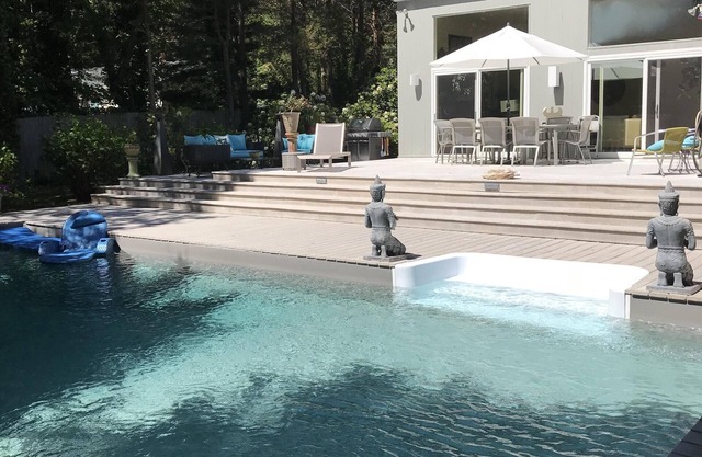 Serene One Level Contemporary with FIVE STAR amenities. Walk To Private Beach.