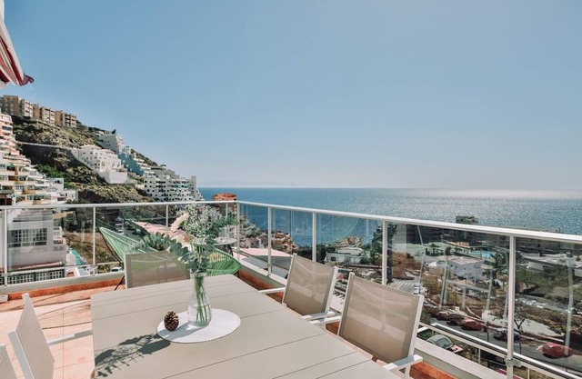 Sit back on the terrace and enjoy incredible views of mountains and the ocean beyond. Flooded with natural light, the interior is beautifully curated in a rich beachside palette of pastel hues with nautical touches.