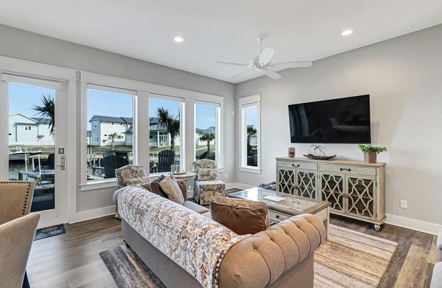 Sophisticated canal-view villa with pool, vast fishing pier, deck & washer/dryer