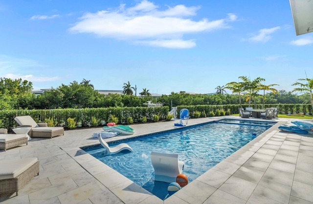 Sophisticated 5-bedroom, elevator, 50' dock, heated pool/spa, sleep 12