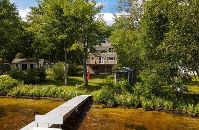 Spacious 3 level home on Little Sebago Lake with sandy entry.