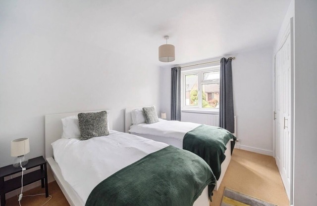 Spacious 4-bedroom townhome in charming Charlton Kings with driveway parking