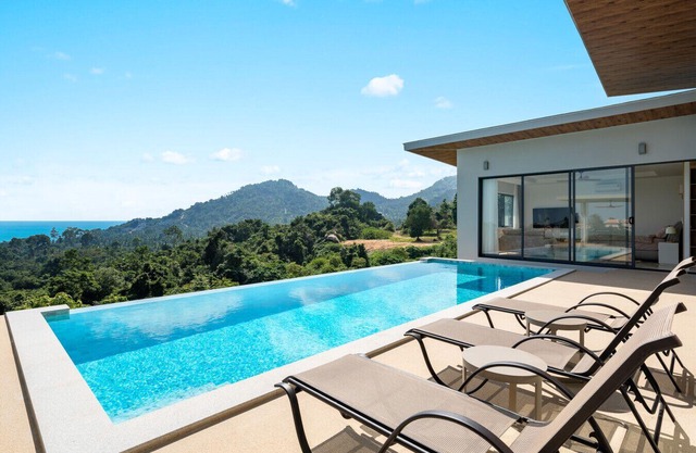 spacious and stylish 4-bedroom private pool villa nestled in the scenic hills of Chaweng Noi.