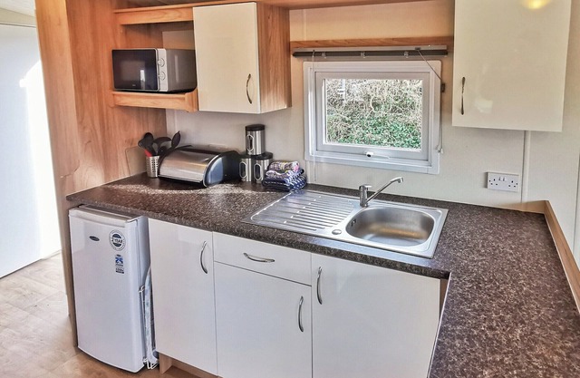 Spacious and well presented, 12-ft wide caravan with one double and one twin bedroom.