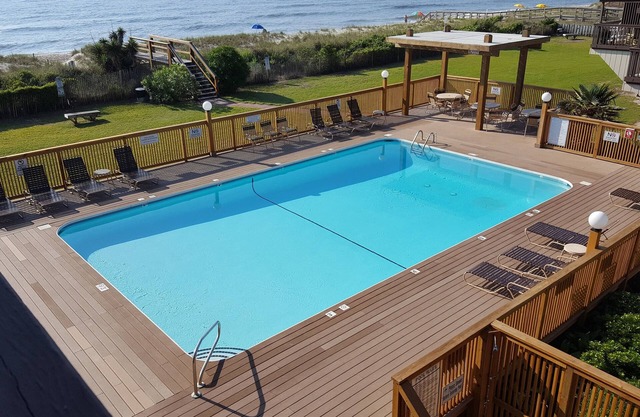 Spacious condo with large deck to view the beautiful ocean just a few feet away.