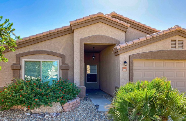 Spacious desert home with hot tub, covered patio, grill, & modern finishes