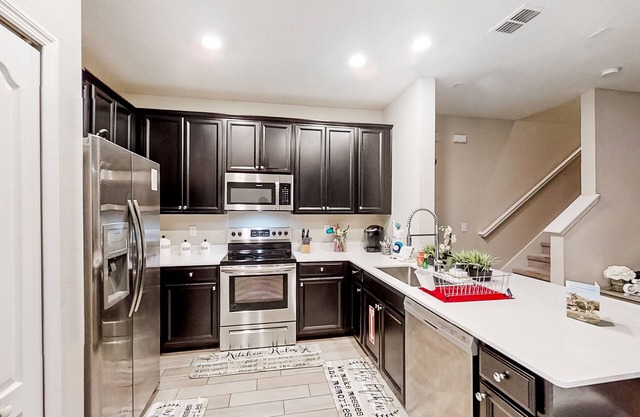 Spacious home with enclosed patio, grill, AC, & W/D - in a great location