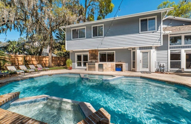 Spacious retreat just minutes from the beach with a stunning pool and game rooms