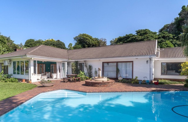 Spacious retreat with large pool and lush garden