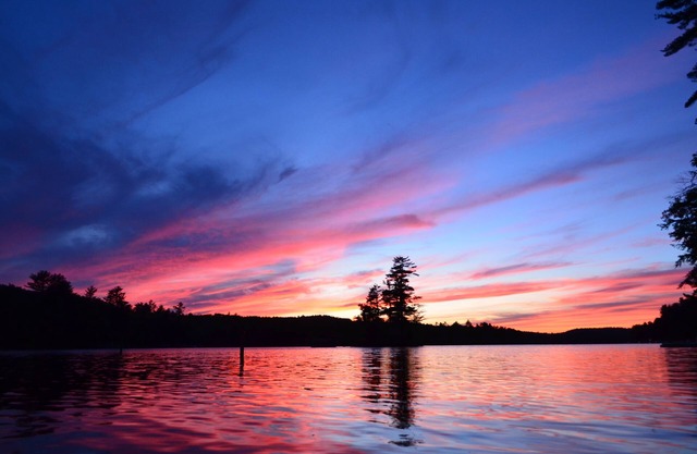 Spacious Sebago Lake waterfront house with game room, hot tub, and covered deck.