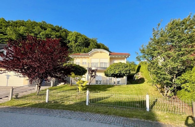 Spacious vacation home with views of the Alps, large balcony and terrace.