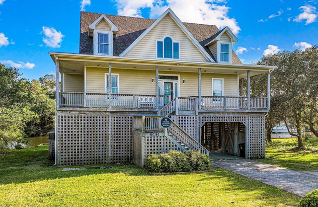 Spacious waterfront home with dock, outdoor shower, W/D, & fish-cleaning station