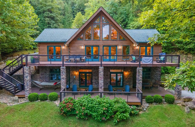 Spacious waterfront property with deck, hot tub, fireplace, & central AC