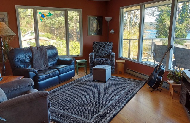 Spectacular beach front property with stunning view of coastal mountains. n
