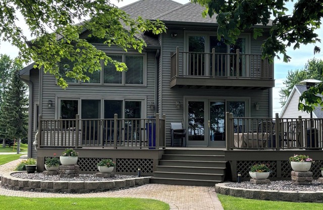 Spectacular, four-bedroom waterfront home near EAA grounds and airport.