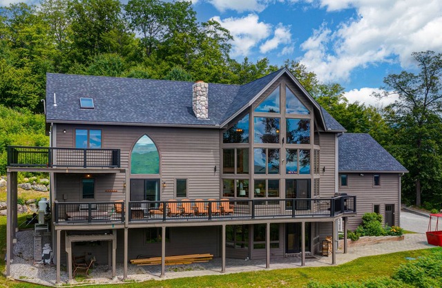 Sprawling mountain-view home with private pool, hot tub, game room, & fireplace