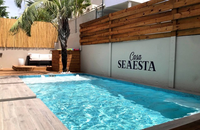 Steps away from the beach, this fully stocked house is perfect for your group!