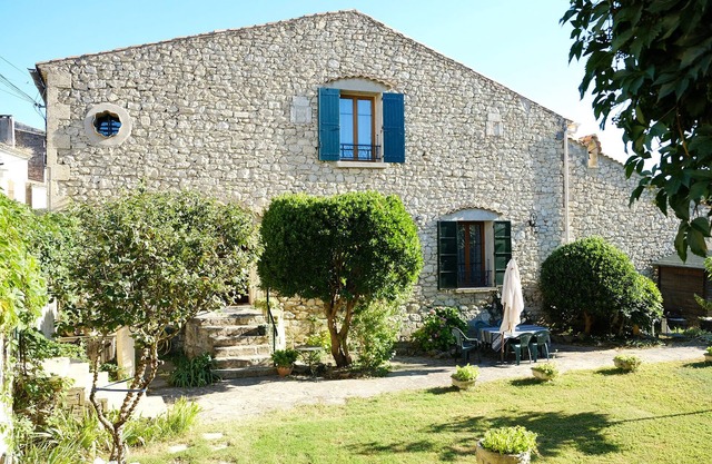 Stone house in a village of Provence by the river