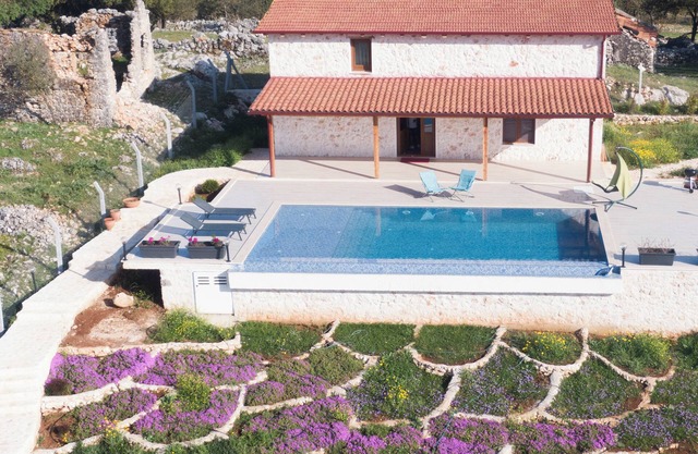 Stone house with private infinity pool in the middle of the oasis