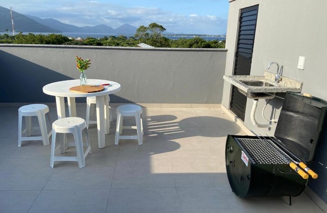 Studio com terraço com linda vista para Lagoa