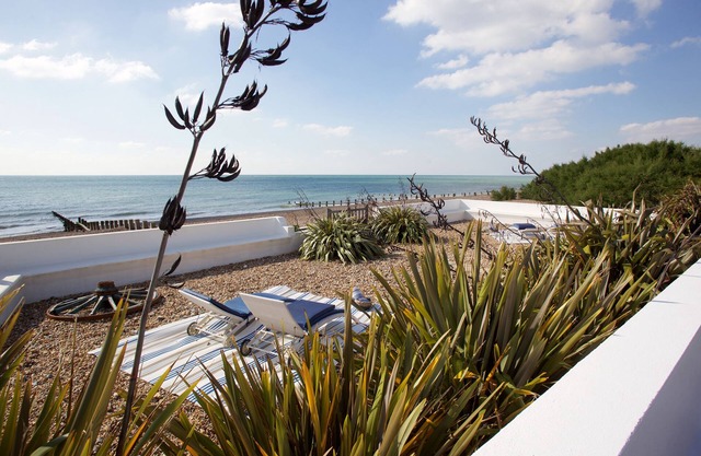 Stunning beach front property with sea views and hot tub featured in Tatler