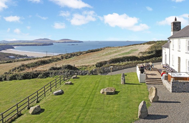 Stunning sea views, idyllic characterful farmhouse with log burner and jacuzzi