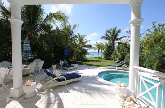 Stunning waterfront property with panoramic sunset views + pool + dock