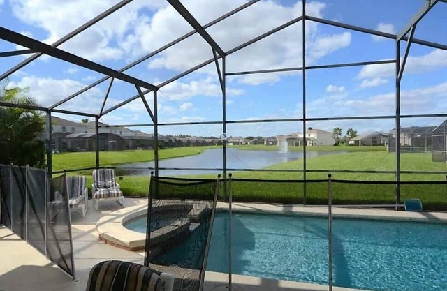 Stunning Waterview Pool Home: Gated, 4BR, Outdoor Spa, Games Room, Free WiFi!