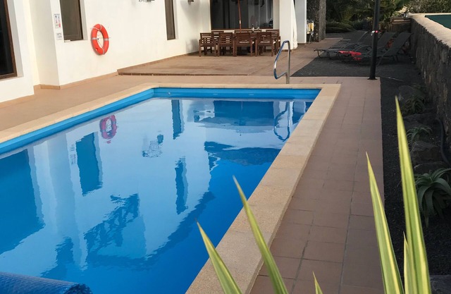 Stylish 4 bedroom villa with heated pool, swim jets,WiFi, & one bed apartment.