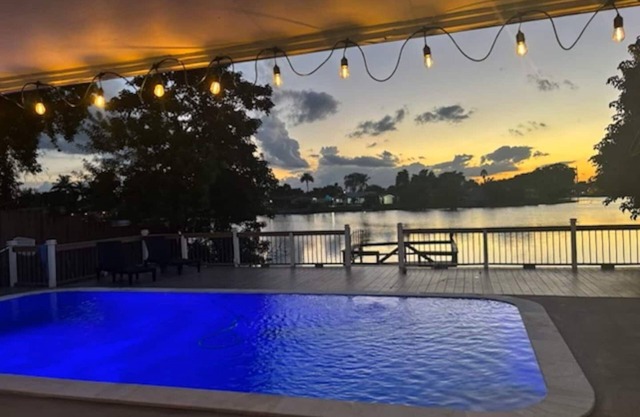 Sublime Lakefront Pool Family Home in Hollywood with Boat Dock & Wonderful Views