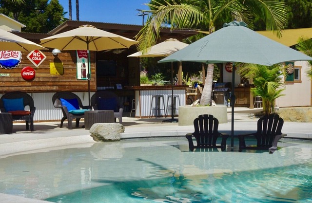 Sunshine and privacy in a resort style setting with pool/jacuzzi and outdoor bar