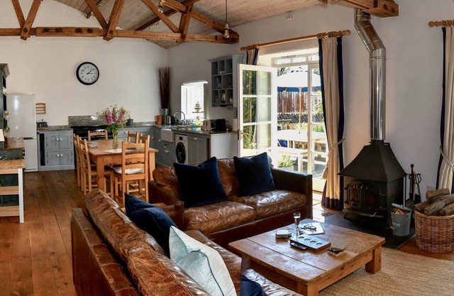 Superb detached Grade II listed barn conversion with private hot tub, close to coast