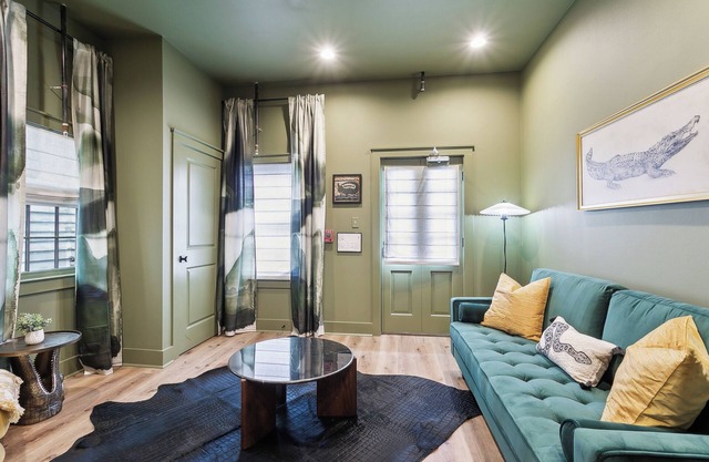 The Bayou Room at Faubourg Orleans. Queen Suite with living area and kitchenette