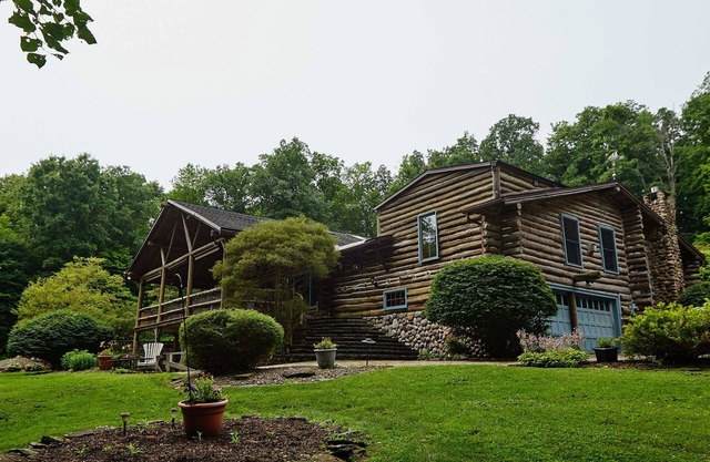 The Chalet of Canandaigua, luxury log cabin on 30 acre property with acre pond
