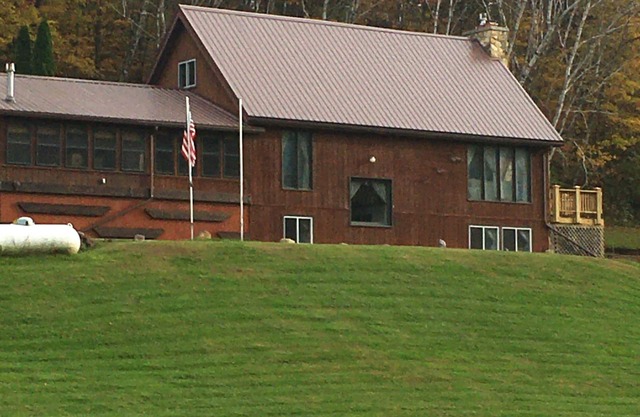 This 3 story home is set on a hillside & includes all imaginable amenities.