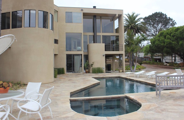 This modern home is a bike ride away from the beach on a private street.