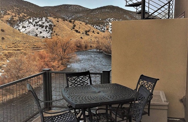 This riverfront downtown condo boasts and open floor plan for kitchen, living room, and dining areas. Or step onto the balcony over the Arkansas River to hear the water rushing by. Oversized master suite has its own balcony and indoor sitting area.