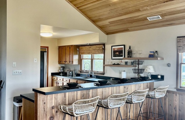 Three-bedroom house with views, decks, golf cart and home gym!