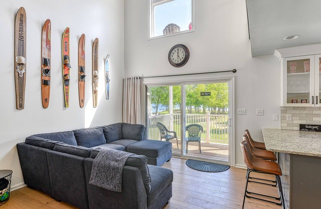 Three-story lakefront home w/covered boat slip, and tennis/pickleball access