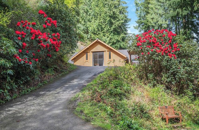 Timber lodge set in an elevated position with views of the lakes.