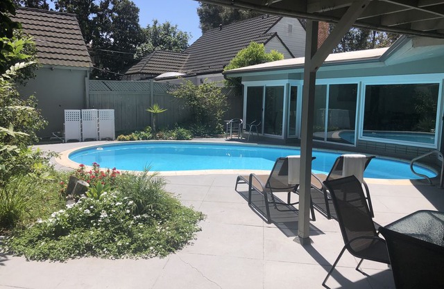 Toluca Lake with a pool