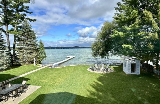 Torch Lake Waterfront Wonder-crystal clear water & shallow sandy walk-out