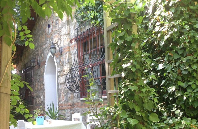 Traditional stone cottage with stunning garden in historic Kaya village.
