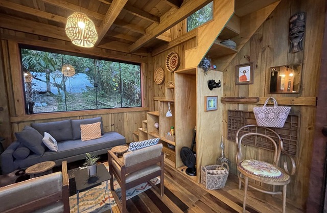 Tree house in front of the lagoon