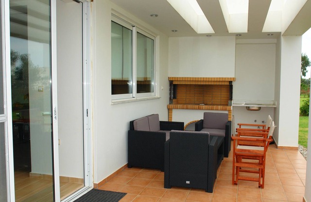 Two bedroom villa with private garden and parking