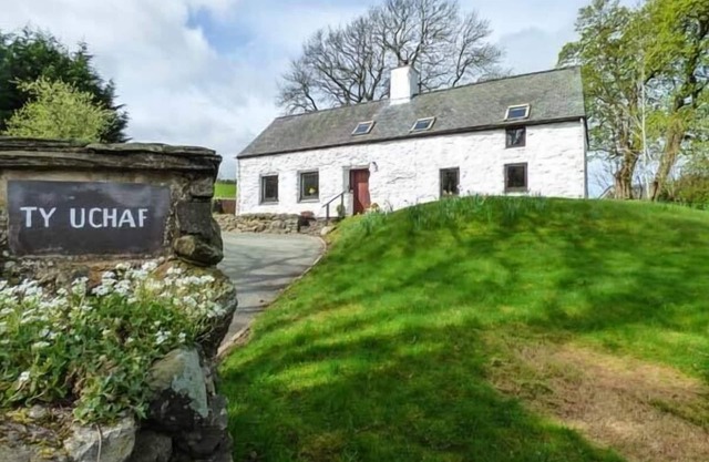 TY UCHAF, character holiday cottage, with open fire in Llangwm