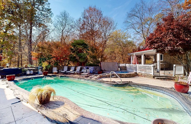 Unique riverfront studio with pool, hot tub, W/D access, grill & AC