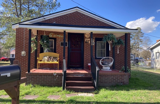 Updated bungalow with screened in porch in rear.